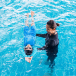 swim instructor and child